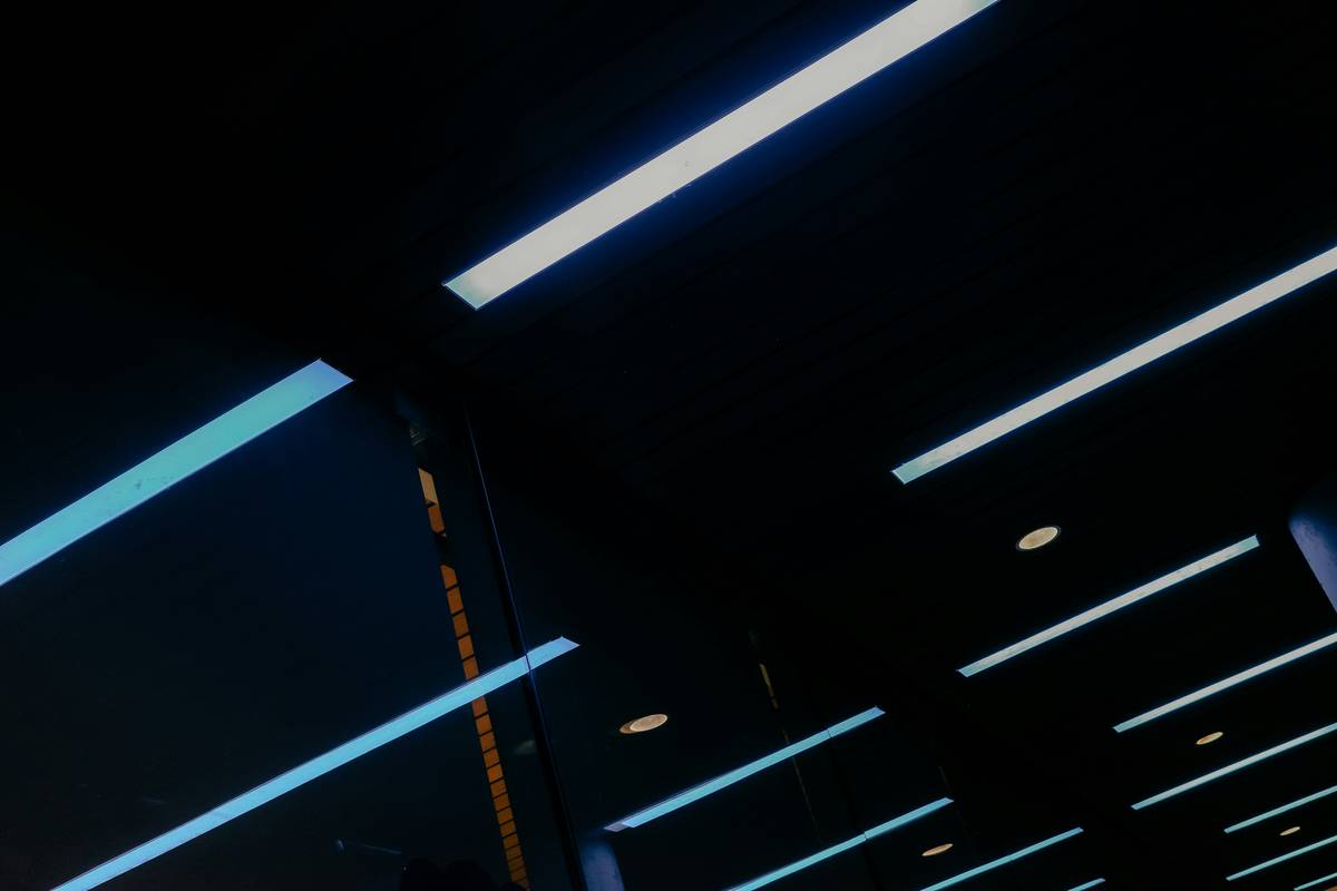 Ultra-slim LED recessed light fixtures mounted directly into drop ceiling grid showing clean flush fit