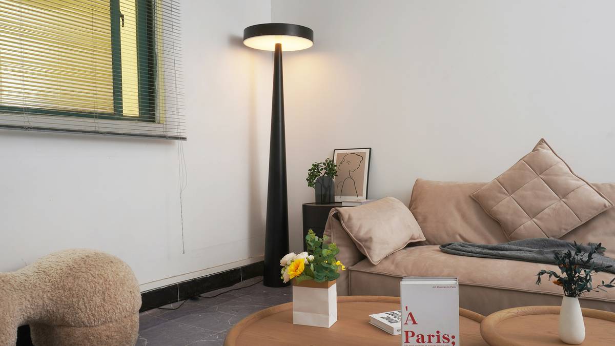 Modern home recessed mounted lighting fixture installed evenly across a white ceiling in a contemporary living room